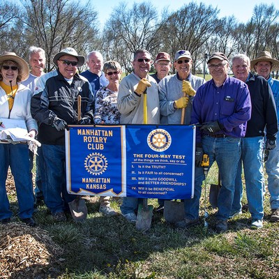 Rotarians planting over 100 trees around the Manhattan community