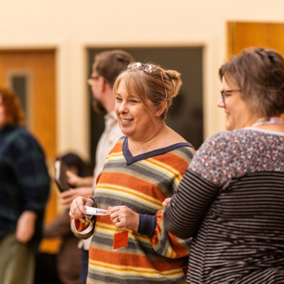 Karla and volunteer chat during FHBB and Common Table Thanksgiving Meal.
