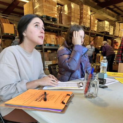 Volunteers from KSU help guests check in at 2023 FHBB Thanksgiving Food Distribution