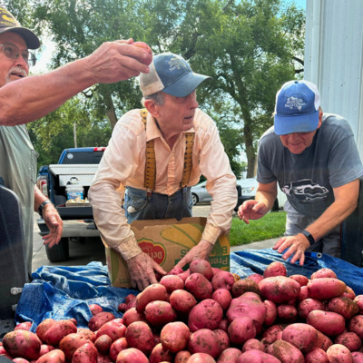 Manhattan Mens Gardening Club dropping off freshly harvested potatoes.