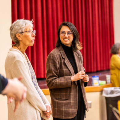Jennie and volunteer chat during FHBB and Common Table Thanksgiving Meal.