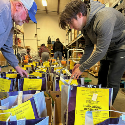 FHBB volunteers searching for guests' Thanksgiving order.
