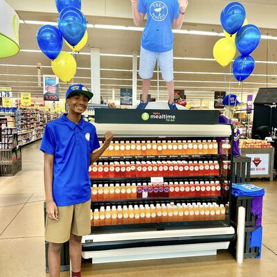 BEFH member Tre's Squeeze showing his display of lemonade at HyVee