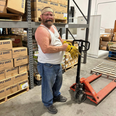 Volunteer working hard in the warehouse.