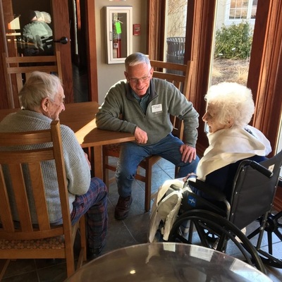 A Hospice Volunteer Visits With Two Hospice Clients