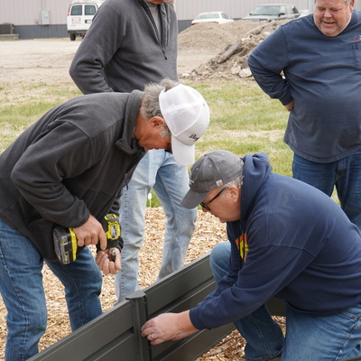 Volunteers put together garden beds